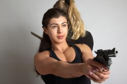 OXANA AND XENIA STANDING POSE WITH GUNS 3